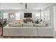 Spacious living room with a comfortable sofa and an abundance of natural light at 6130 Colmar Pl, Apollo Beach, FL 33572
