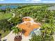 A community splash pad complete with benches and lounge chairs, surrounded by palm trees and grassy areas at 6130 Colmar Pl, Apollo Beach, FL 33572