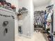 Walk-in closet with shelving, rods, and a ProVault safe for maximum storage at 6130 Colmar Pl, Apollo Beach, FL 33572