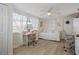 Bedroom featuring a day bed, a desk, a chair, and large windows allowing natural light at 6144 Glenwood Dr, New Port Richey, FL 34653