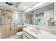 Bathroom with an updated vanity, large mirror, and glass shower door at 6282 Darien Way, Spring Hill, FL 34606