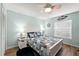 Bedroom with a ceiling fan, area rug, and an abundance of natural light at 6282 Darien Way, Spring Hill, FL 34606