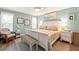 Bedroom featuring hardwood floors, beachy decor, and a ceiling fan at 6282 Darien Way, Spring Hill, FL 34606