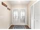 Bright entryway featuring beautiful double doors and a coat closet for added convenience at 6282 Darien Way, Spring Hill, FL 34606