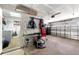 Spacious two car garage with laundry, work bench, and plenty of storage for tools and equipment at 6282 Darien Way, Spring Hill, FL 34606