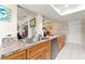 Spacious kitchen featuring stainless steel appliances, ample granite counter space, and wood cabinetry at 6282 Darien Way, Spring Hill, FL 34606