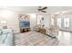 Bright living room featuring comfortable seating, wood-look floors and natural light at 6282 Darien Way, Spring Hill, FL 34606