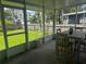 Screened patio with a backyard view, ideal for relaxing and enjoying the outdoors at 6826 Driftwood Dr, Hudson, FL 34667