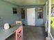 Covered patio area showing a table and chairs, perfect for outdoor dining at 6826 Driftwood Dr, Hudson, FL 34667