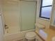 Bathroom featuring a tub and shower combination and a vanity at 6932 Pin Cherry Ln, Port Richey, FL 34668