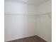 Walk-in closet with wire shelving offers lots of room for storage and organization at 6932 Pin Cherry Ln, Port Richey, FL 34668