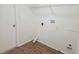 Laundry room features washer and dryer hookups and shelving for storage at 6932 Pin Cherry Ln, Port Richey, FL 34668