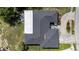 Aerial view of home featuring a well-maintained roof and landscaping at 7133 Box Elder Dr, Port Richey, FL 34668