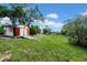Large backyard offering ample space and featuring a weathered storage shed at 7133 Box Elder Dr, Port Richey, FL 34668