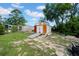 An expansive backyard includes two storage sheds and plenty of green space at 7133 Box Elder Dr, Port Richey, FL 34668