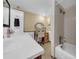 Bathroom featuring a large vanity with integrated sink and combination tub and shower at 7133 Box Elder Dr, Port Richey, FL 34668