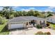 Charming one-story home with a well-maintained lawn and inviting curb appeal and attached two car garage at 7133 Box Elder Dr, Port Richey, FL 34668