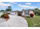 Charming home with a well-manicured lawn and inviting driveway and attached two car garage at 7133 Box Elder Dr, Port Richey, FL 34668