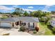 Charming one-story home with a well-maintained lawn, a well-manicured lawn, and inviting curb appeal at 7133 Box Elder Dr, Port Richey, FL 34668
