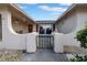 Welcoming front porch with a gated entry and charming architectural details and landscaping at 7133 Box Elder Dr, Port Richey, FL 34668