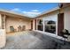 Inviting front porch with outdoor seating, a decorative wreath, and a large window at 7133 Box Elder Dr, Port Richey, FL 34668