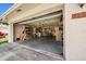 Spacious two car garage with ample storage, shelving, and concrete flooring at 7133 Box Elder Dr, Port Richey, FL 34668