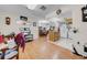Open living area with hardwood floors, dining area, and a bright, modern kitchen at 7133 Box Elder Dr, Port Richey, FL 34668