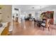 Open-concept living spaces featuring hardwood floors, ample natural light, and dining area at 7133 Box Elder Dr, Port Richey, FL 34668