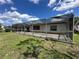 Spacious screened patio with ample room for outdoor entertaining and relaxing on a sunny day at 8312 Split Rail Ln, Hudson, FL 34667