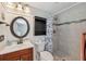 Charming bathroom featuring a single vanity, shower with a floral shower curtain at 8404 Fishhawk Ave, New Port Richey, FL 34653