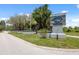 Welcome to Park Lake Estates: a charming community entrance with lush landscaping and a welcoming atmosphere at 8404 Fishhawk Ave, New Port Richey, FL 34653