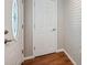 Welcoming entryway featuring wood floors, neutral walls, and classic doors, blending style and function at 8404 Fishhawk Ave, New Port Richey, FL 34653