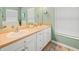 Bathroom with double sinks, ample counter space, and stylish cabinets at 8457 Southern Charm Cir, Brooksville, FL 34613