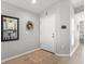 Home foyer featuring light gray walls, wood flooring, and a modern keypad at 8457 Southern Charm Cir, Brooksville, FL 34613