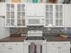 Kitchen boasts stainless appliances, mosaic backsplash and decorative elements at 8457 Southern Charm Cir, Brooksville, FL 34613