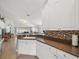 Open kitchen with a breakfast bar that overlooks the living room at 8457 Southern Charm Cir, Brooksville, FL 34613