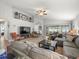 Spacious living room featuring vaulted ceilings, wood flooring and large comfortable seating at 8457 Southern Charm Cir, Brooksville, FL 34613
