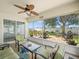 Inviting screened patio with comfortable seating and views of the landscaped backyard at 8457 Southern Charm Cir, Brooksville, FL 34613