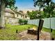 Inviting backyard featuring a fire pit and well-maintained lawn, perfect for outdoor relaxation and entertaining at 952 Coachlight Ln, Brooksville, FL 34601