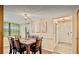 Charming dining room featuring a wooden table set for six, with warm lighting and neutral decor at 952 Coachlight Ln, Brooksville, FL 34601