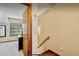 Cozy hallway with stairs and access to a bedroom, offering a glimpse of the home's layout at 952 Coachlight Ln, Brooksville, FL 34601