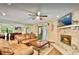 Inviting living room showcases stone fireplace, wood flooring, and lots of seating at 952 Coachlight Ln, Brooksville, FL 34601