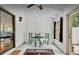 Enclosed porch with a view, featuring a table and chairs, a rug and plenty of natural light at 952 Coachlight Ln, Brooksville, FL 34601