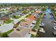 Aerial view of the waterfront community with canal access, boat docks, and well-maintained homes at 9921 San Mateo Way, Port Richey, FL 34668