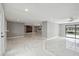 Spacious living room featuring marble floors and an open layout, perfect for modern living and entertaining at 9921 San Mateo Way, Port Richey, FL 34668