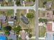 From above, a quaint community with lovely homes and well-kept lawns sits alongside quiet streets at 10091 Bannister St, Spring Hill, FL 34608