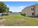 Large backyard with lush greenery and privacy fencing, perfect for outdoor activities and relaxation at 10091 Bannister St, Spring Hill, FL 34608
