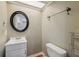 Cozy half-bathroom with modern vanity and round mirror at 10091 Bannister St, Spring Hill, FL 34608