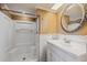 Bathroom featuring a shower, a vanity with sink, and an oval mirror at 10091 Bannister St, Spring Hill, FL 34608