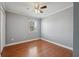 Bright bedroom with a ceiling fan and natural light from the window at 10091 Bannister St, Spring Hill, FL 34608